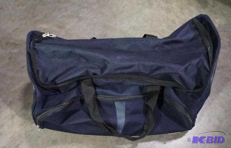 Tag travel duffle. Dark blue in color  on wh...