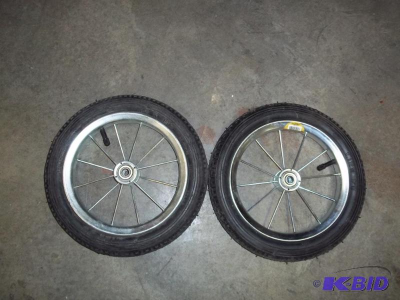 lot 21 image: Pair of 12" Pneumatic spoke wheel...
