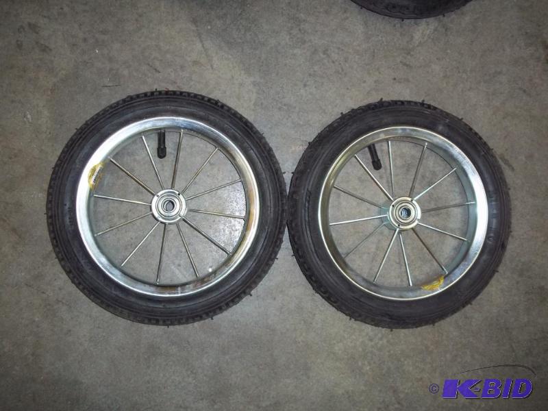 lot 22 image: Pair of 12" Pneumatic spoke wheel...
