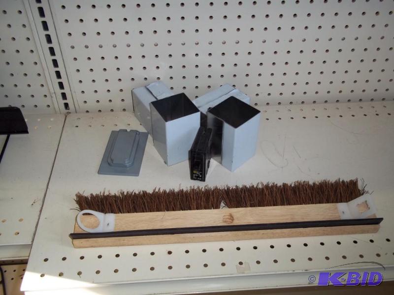 lot 29 image: Driveway brush and electrical box cover...