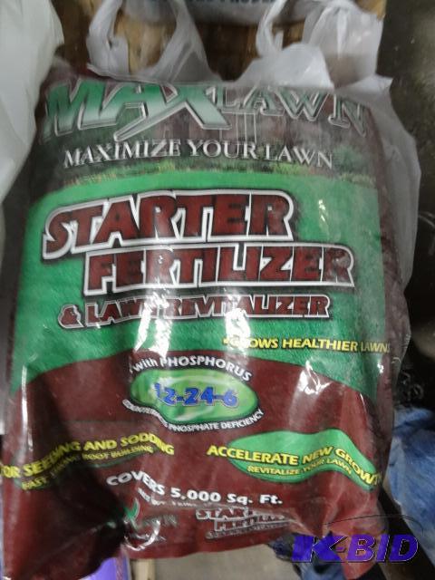 lot 309 image: New bag of Max lawn starter fertilizer on the...