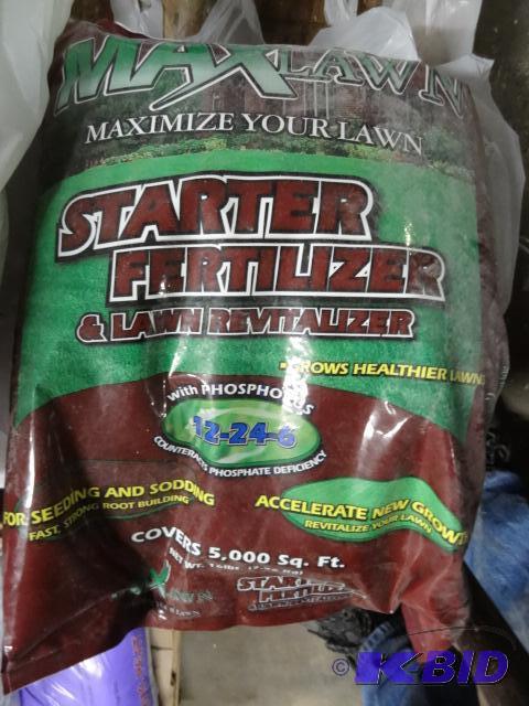 lot 310 image: New bag of Max lawn starter fertilizer on the...