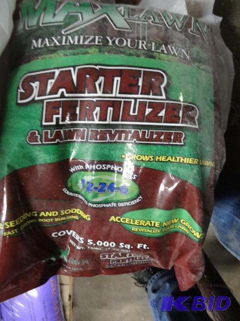 lot 311 image: New bag of Max lawn starter fertilizer on the...