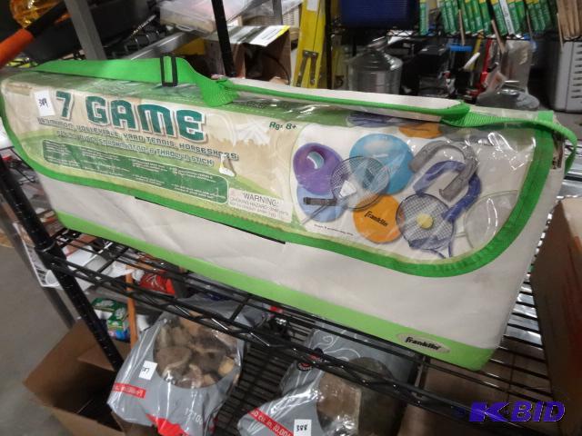 lot 384 image: New 7 game family outing set by Franklin. Bad...