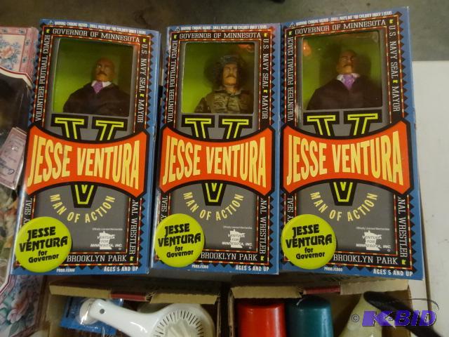 lot 129 image: Jesse Ventura dolls. 2 are suits and 2 are ma...