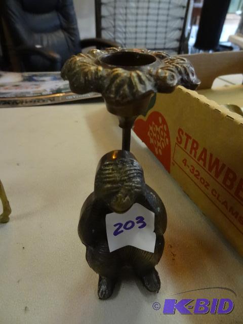 lot 203 image: Brass monkey candle holder...
