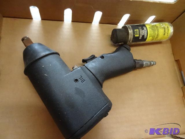 lot 211 image: 12 impact gun with lubricant. Works...