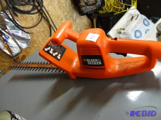lot 304 image: Black and Decker electric hedge trimmer...