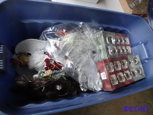 lot 329 image: Rubbermaid 50 gal tote with Christmas decorat...