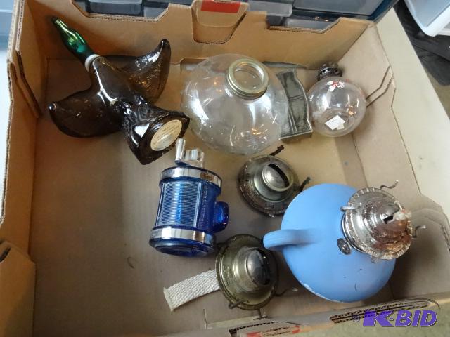 lot 364 image: Avon bottles. Oil lamps and parts...