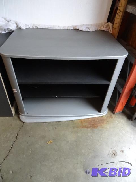 lot 423 image: Entertainment center. Base swivels. 36 x 24 x...
