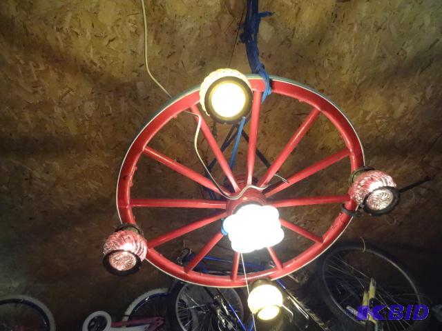 lot 427 image: Vintage wagon wheel turned into a chandelier....