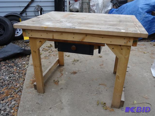 lot 48 image: Wood work bench. Has 1 drawer. 48 x 36 x 35. ...