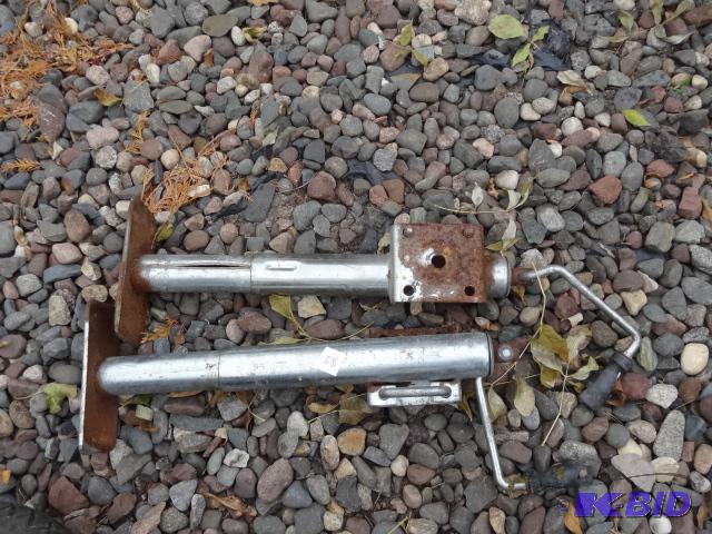 lot 55 image: 2 trailer jacks. Missing mounting hardware...