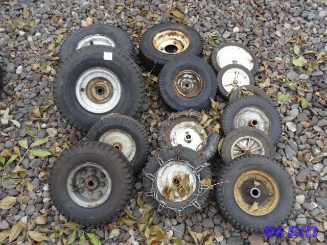 lot 62 image: Large lot of lawn mower wheels....