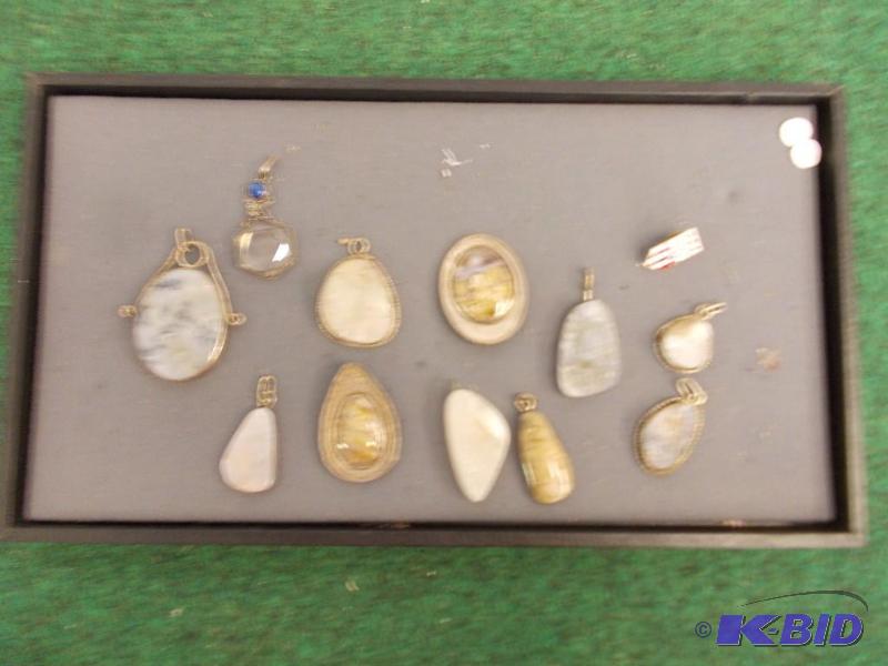 lot 44 image: Collection of Polished Rocks Set as Pendants...