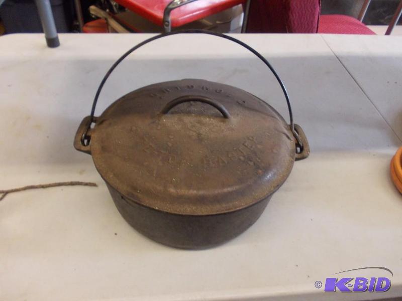 lot 55 image: Griswold #9 Cast Iron Dutch Oven with Lid...
