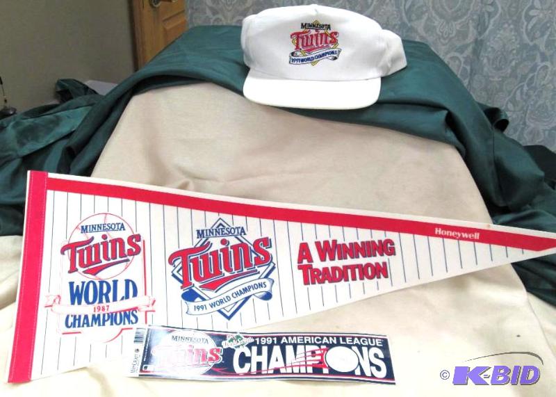 lot 117 image: Twins 1991 championship hat , flag, and bumpe...