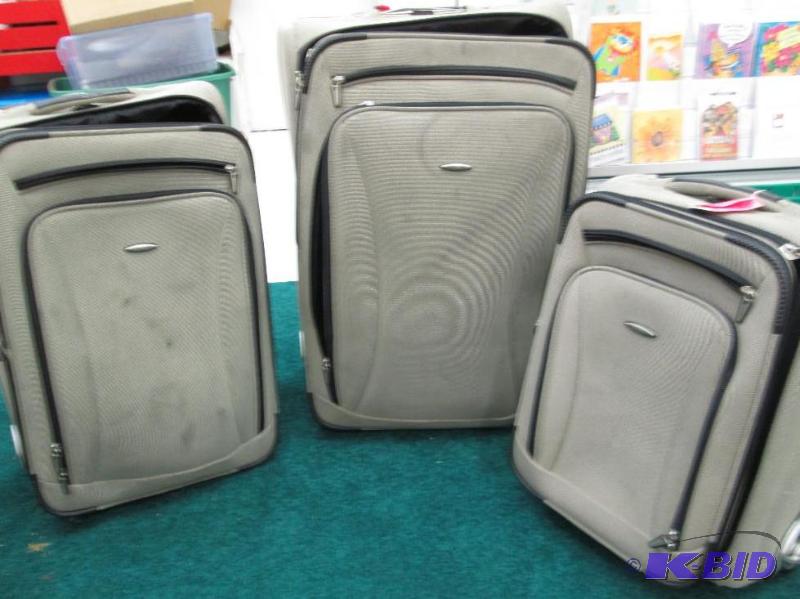 lot 127 image: 4 PC luggage set tan and black is on wheels -...