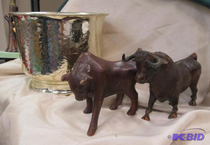 lot 169 image: Flower pot and two wooden cows...