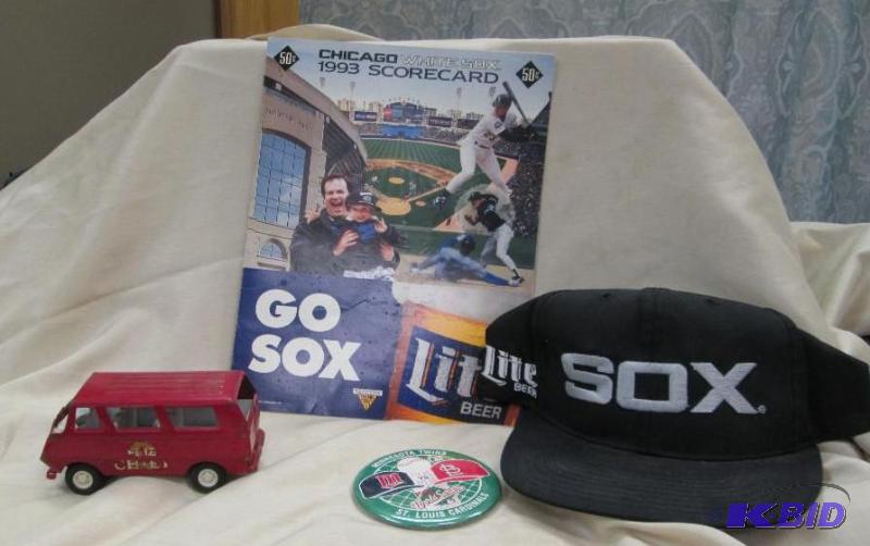 lot 214 image: Qty 4 Sox hat, twins button, and red truck...