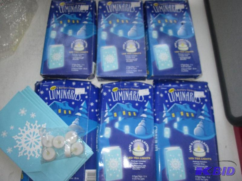 Lot of LED tea light luminaries in paper bags...
