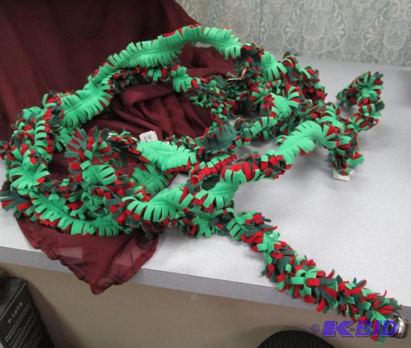 Garland made out of fleece green and red with...