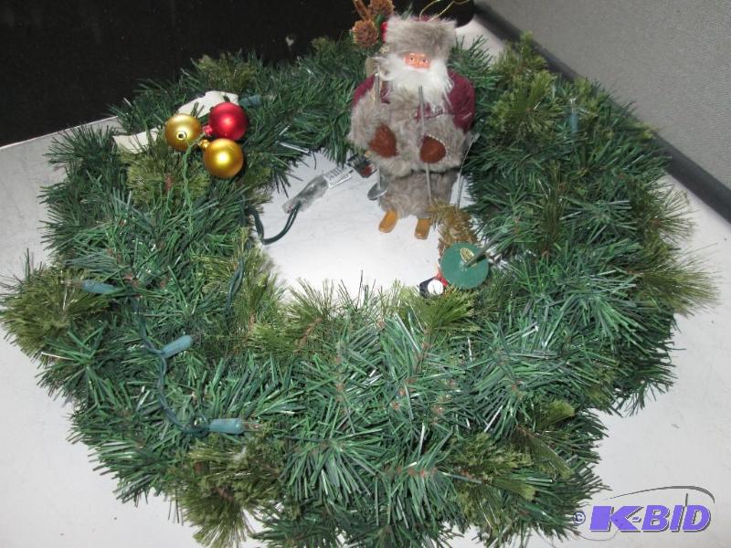 Lighted artificial wreath with santa on skiis...
