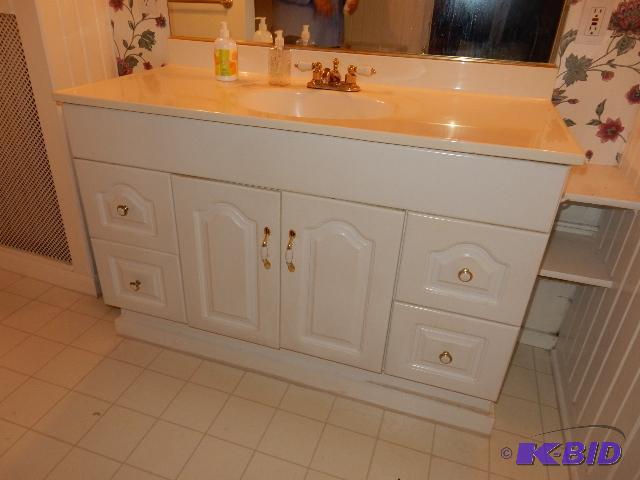 Bathroom Vanity and Mirror. You must unhook t...