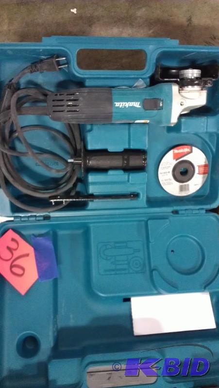 lot 36 image: Makita 4" Angle Grinder with case cuttin...
