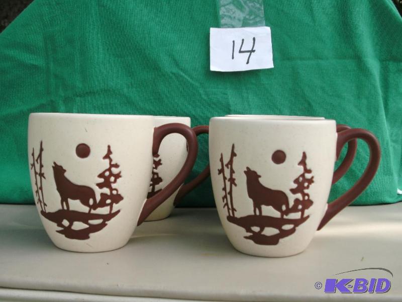 4 mugs with Wolf motif on them. They are slig...