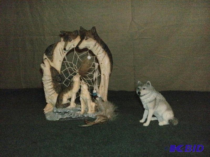 Statues of wolves. One looks like a dream cat...