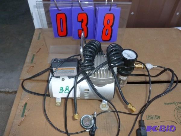 Air brush compressor with hose and gun. For a...