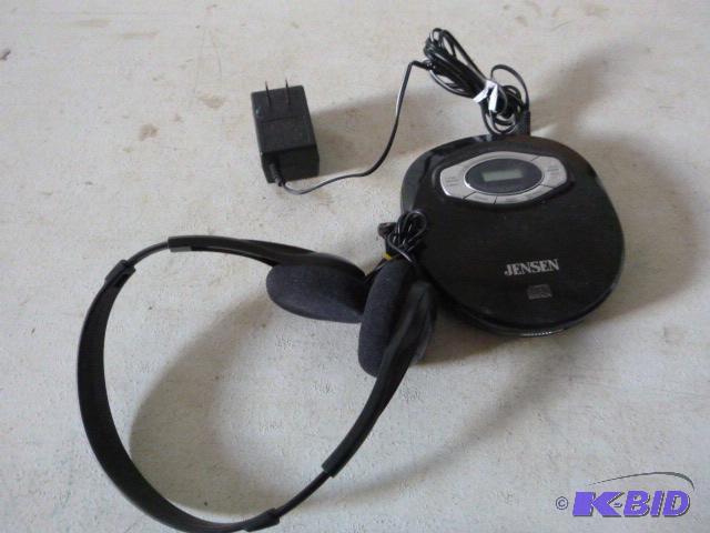 lot 13 image: Jensen Portable CD Player With digital headph...