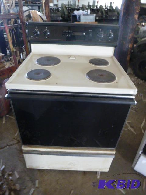 lot 180 image: GE Electric Stove Beige in color....