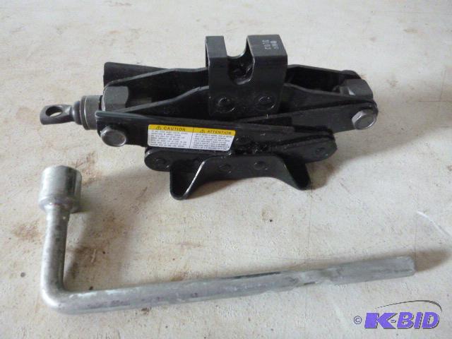 lot 230 image: Small Car Jack and Tire Iron...
