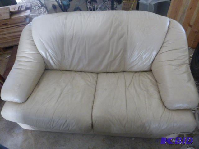 lot 3 image: Leather Like Love Seat Missing leg, has a tea...