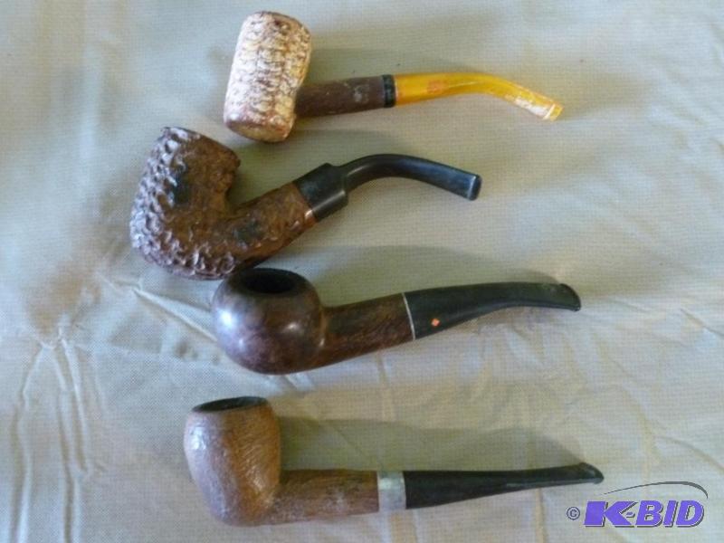 lot 23 image: Lot of four collectible smoking pipes....