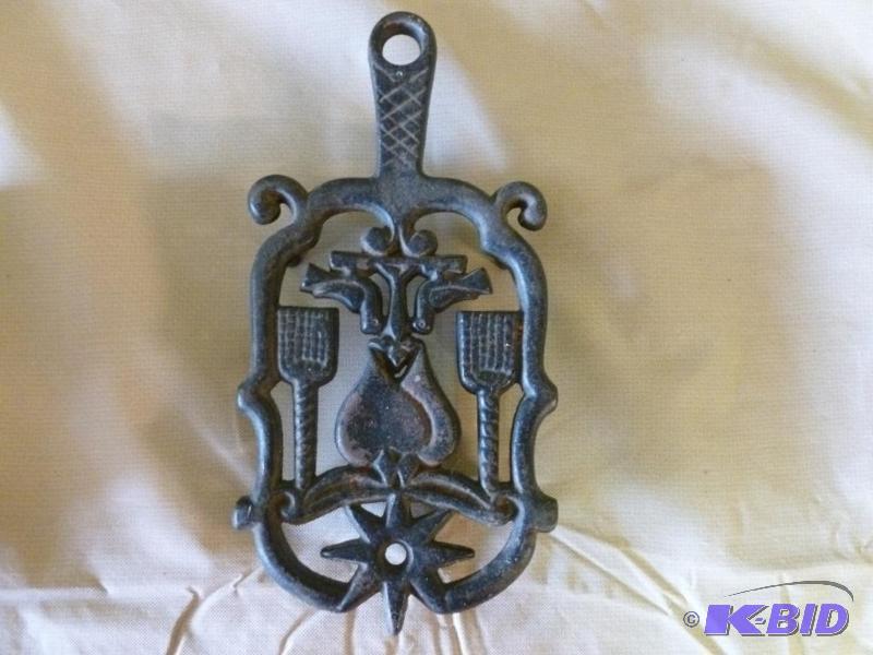 lot 27 image: Large cast iron hot pan trivet that measures ...