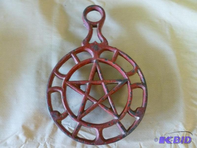 lot 28 image: Large cast iron hot pan trivet that measures ...