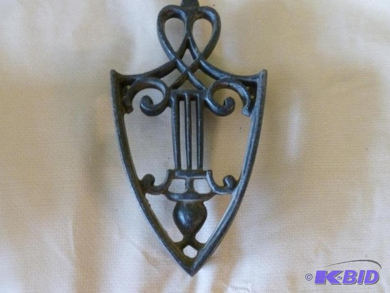 lot 30 image: Large cast iron hot pan trivet that measures ...
