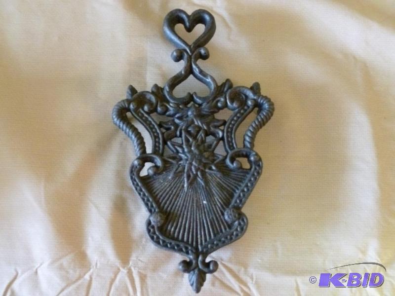 lot 31 image: Large cast iron hot pan trivet that measures ...