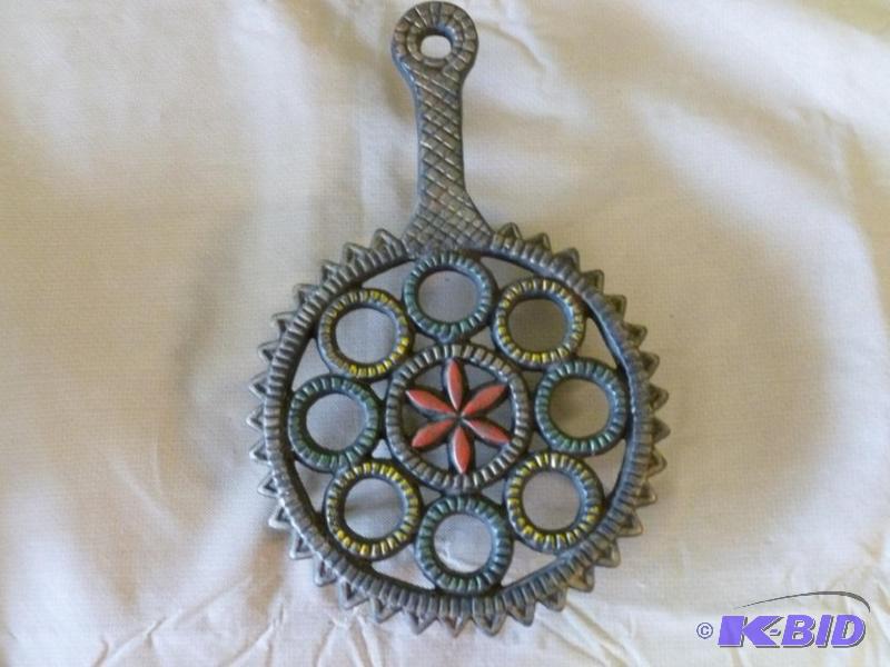 lot 32 image: Large cast iron hot pan trivet that measures ...
