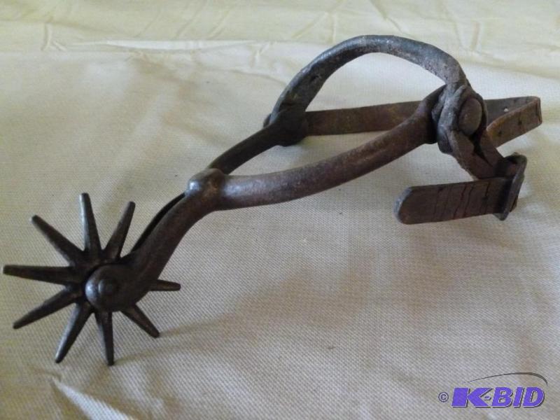 lot 39 image: Vintage iron boot spur with leather strap, go...