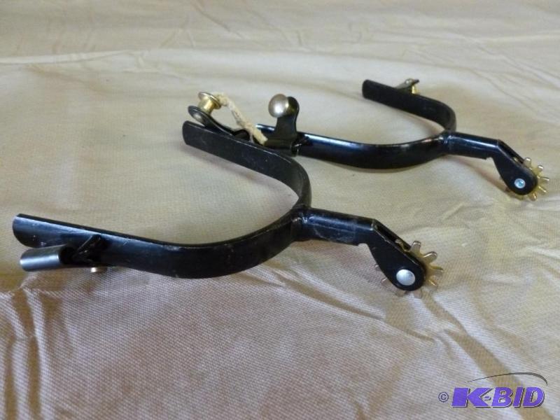 lot 40 image: A pair of metal boot spurs....