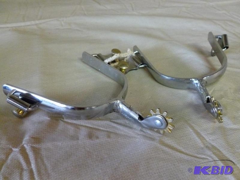 lot 41 image: A pair of chrome plated metal boot spurs....