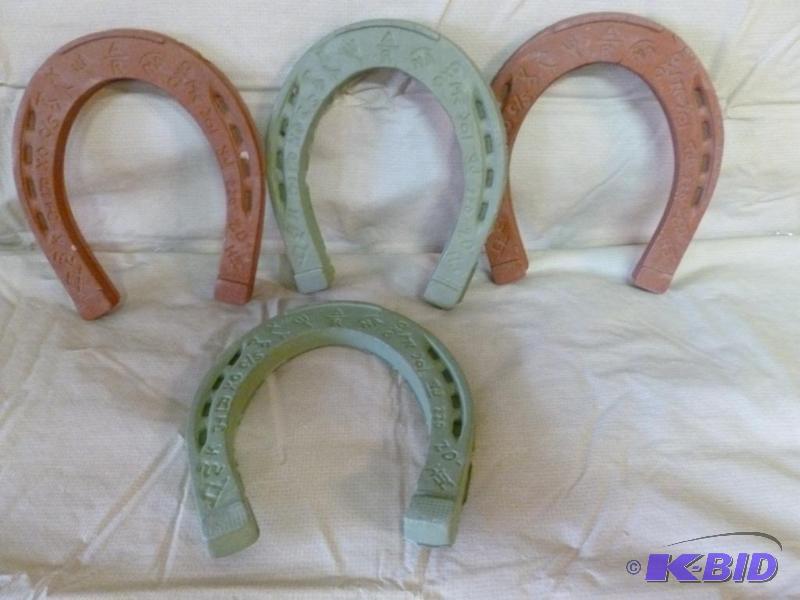 lot 42 image: A set of four vintage hard rubber horseshoes,...