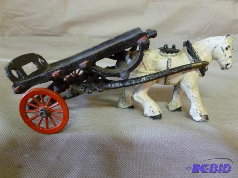 lot 45 image: Antique lead horse and wagon mantle decoratio...