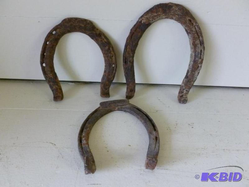 lot 86 image: Lot of three large antique iron horseshoes.&n...