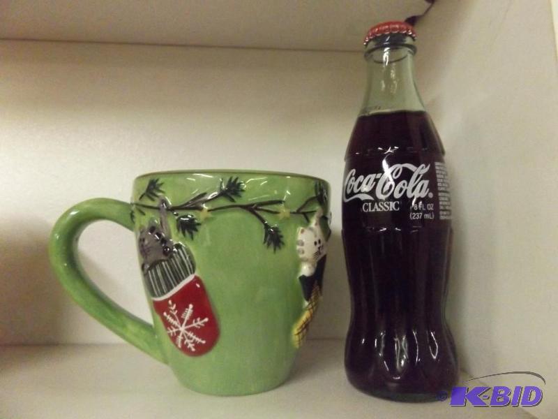 Kitten Coffee Mug and bottle of Coca Cola...